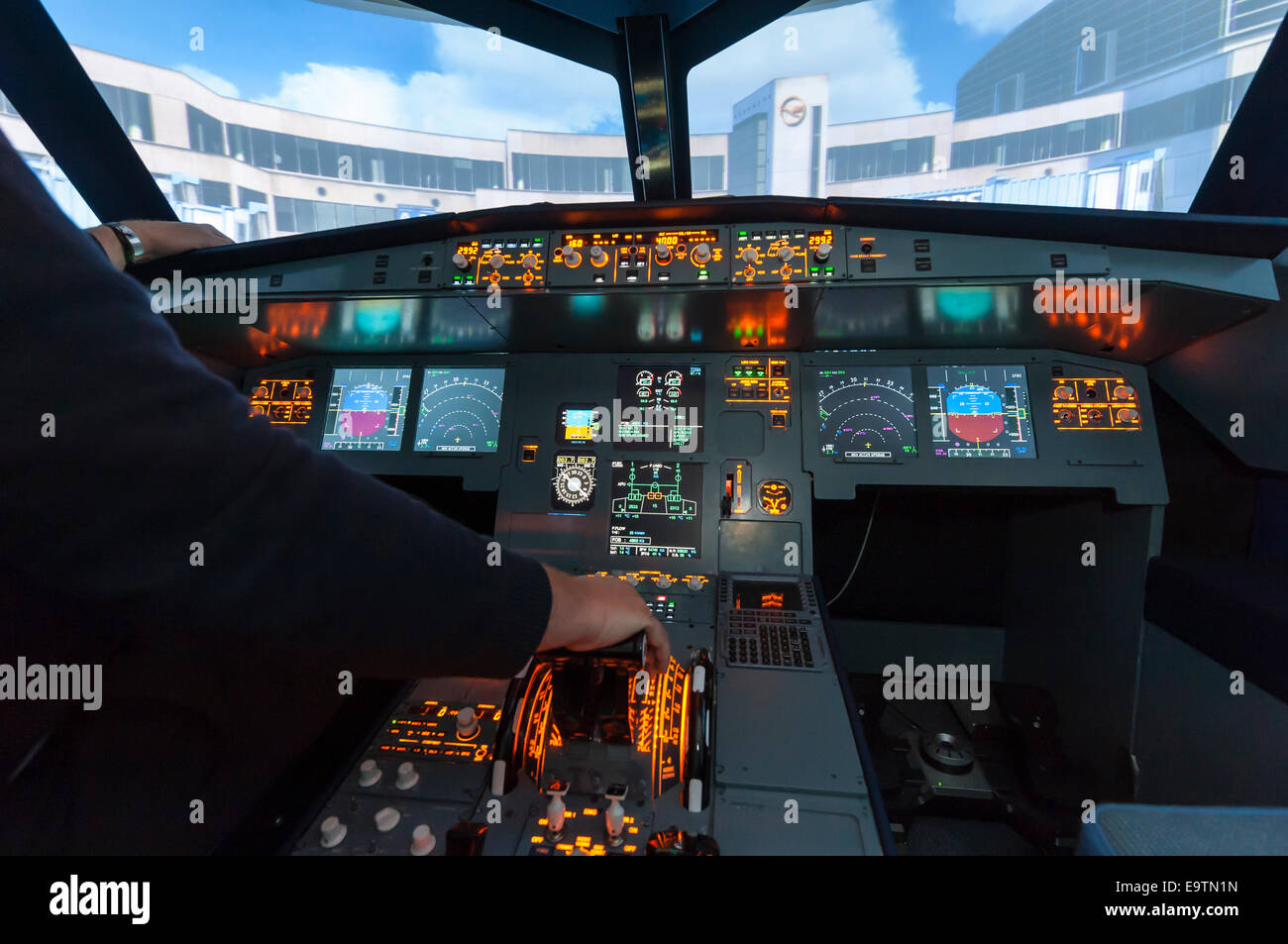 Cockpit of an Airbus A320 flight simulator that is used for training of professional airline pilots (after landing) Stock Photo