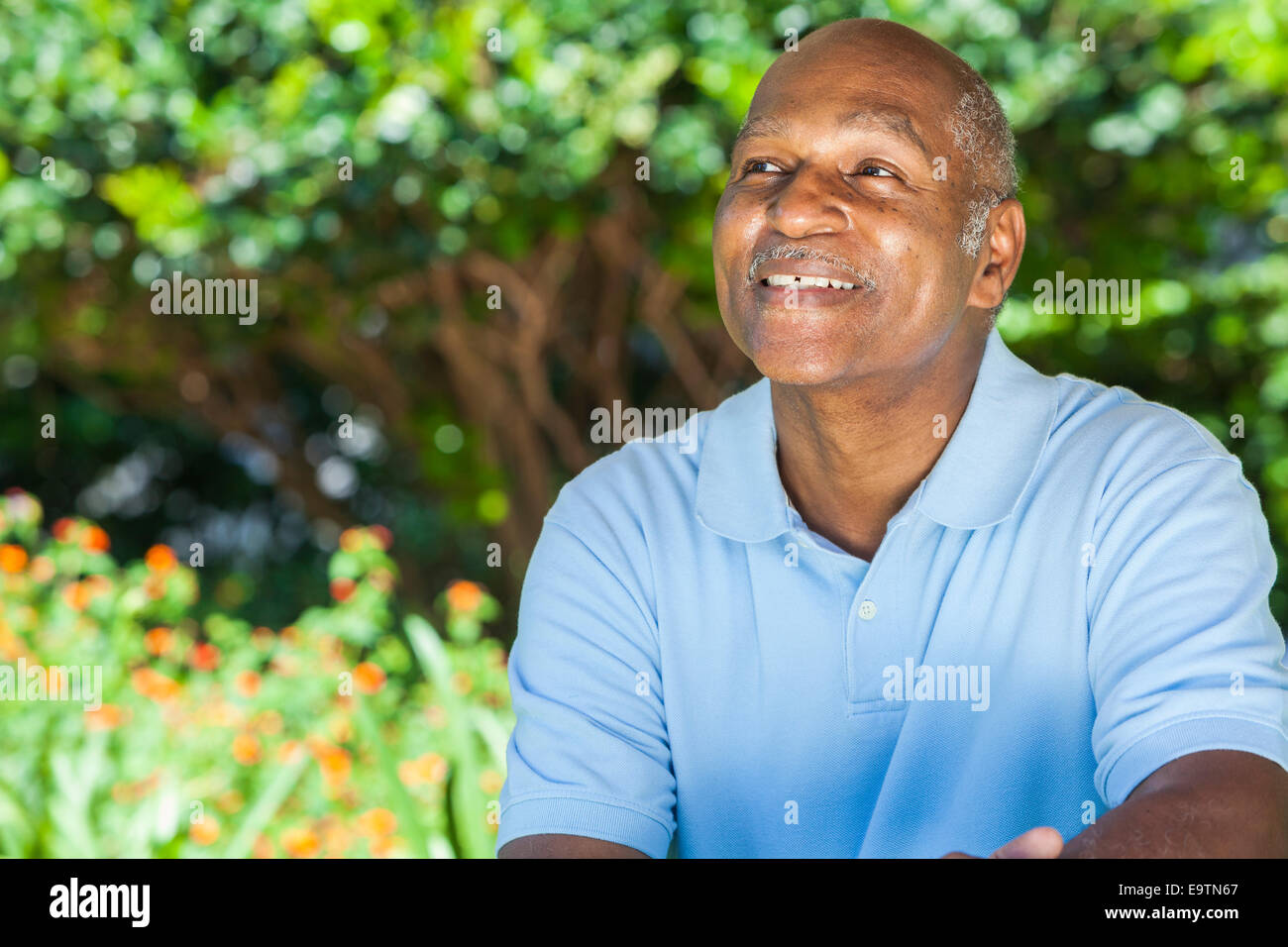 A happy senior African American man in his sixties outside smiling Stock Photo