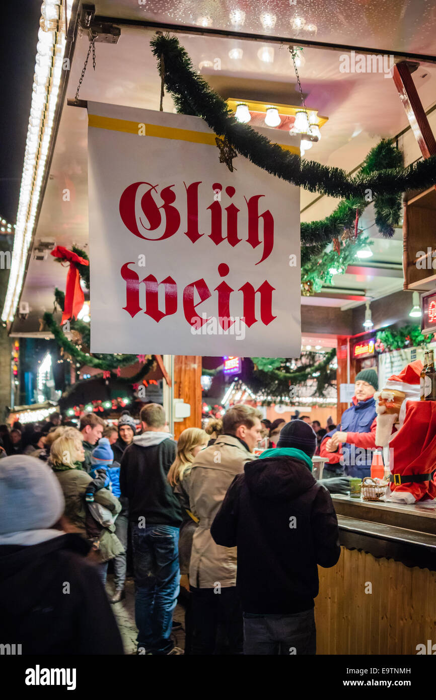 Holiday market in Germany, people buying mulled wine Stock Photo