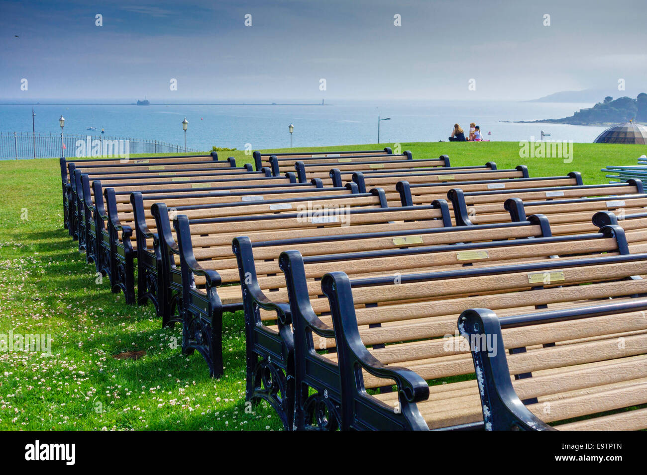 Benches lined up on Plymouth Hoe Devon UK Stock Photo