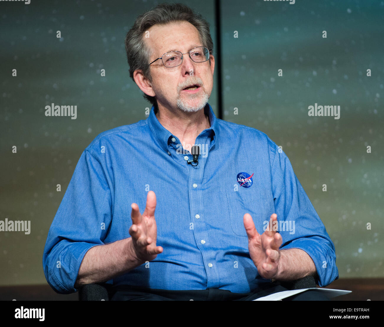 Jim Green, director, Planetary Science Division, NASA Headquarters, Washington gives remarks during a media briefing where he and other panelists outlined how space and Earth-based assets will be used to image and study comet Siding Spring during its Sund Stock Photo