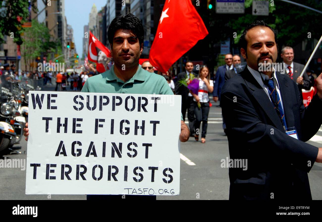 NYC Man holding antiterrorism sign at Turkish Day Parade on Madison