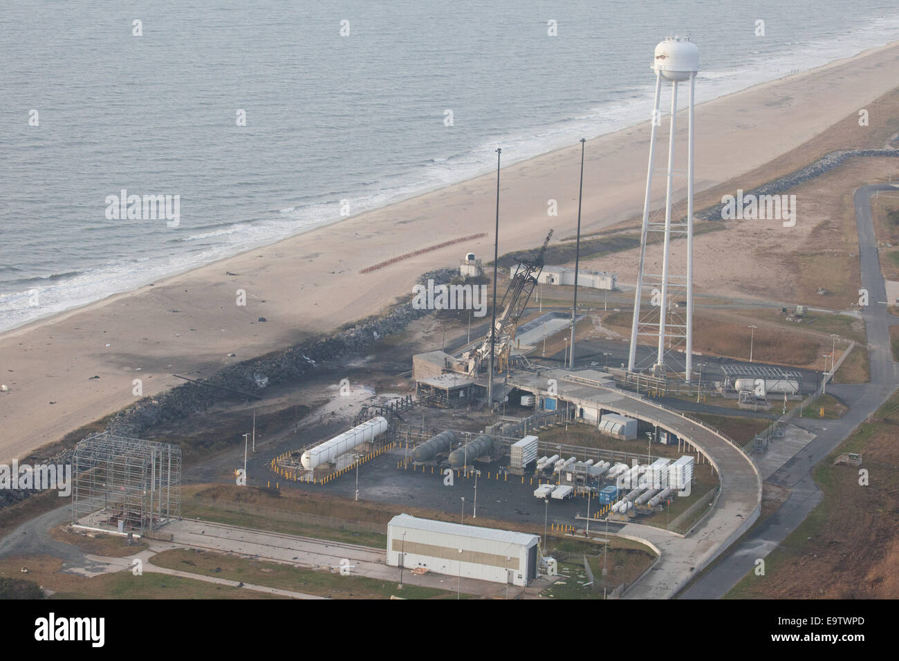 An aerial view of the Wallops Island launch facilities taken by the Wallops Incident Response Team Wednesday, Oct. 29, 2014 following the failed launch attempt of Orbital Science Corp.'s Antares rocket Oct. 28, Wallops Island, VA. Stock Photo