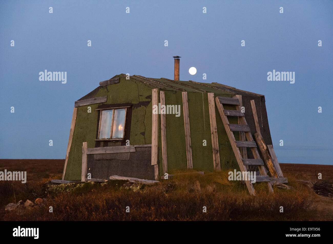 Moon and open wilderness hut Stock Photo