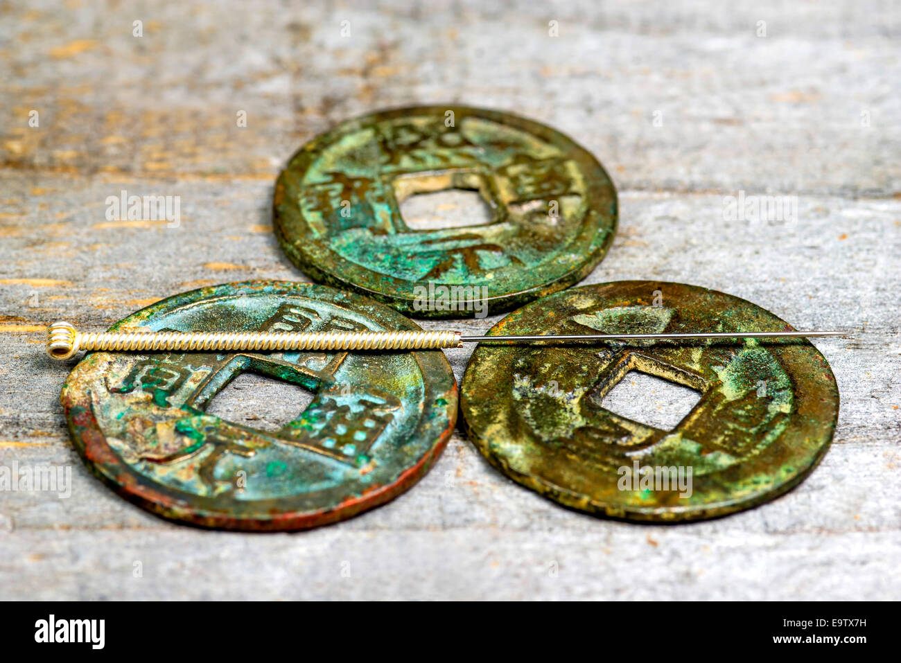 acupuncture needle on antique Chinese coin Stock Photo Alamy