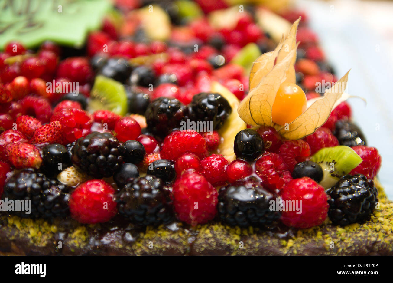 Part of a mixed berries cake with a lot of fresh fruit Stock Photo