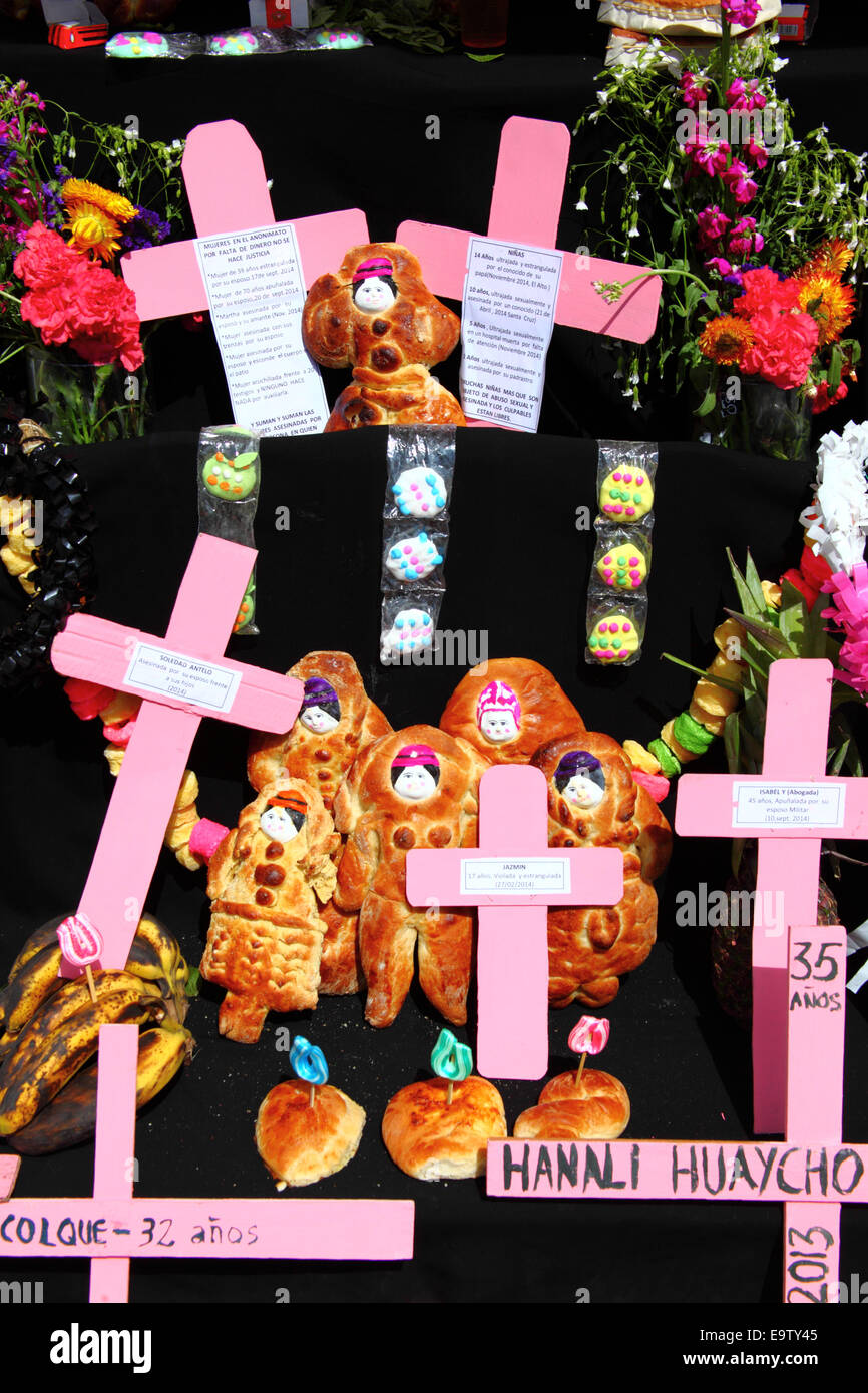 EL ALTO, BOLIVIA, 2nd November 2014. Detail of a typical altar or mesa for Todos Santos festival with names of women who are recent victims of femicide and domestic violence. These altars are built to welcome the souls of loved ones who it is believed return to Earth on November 1st to visit their families. According to a WHO report in January 2013 Bolivia is the country with the highest rate of violence against women in Latin America. Credit:  James Brunker/Alamy Live News Stock Photo