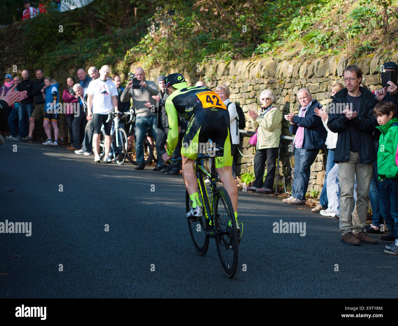 Cyclist in hill climbing race in Ramsbottom, Lancashire Stock Photo
