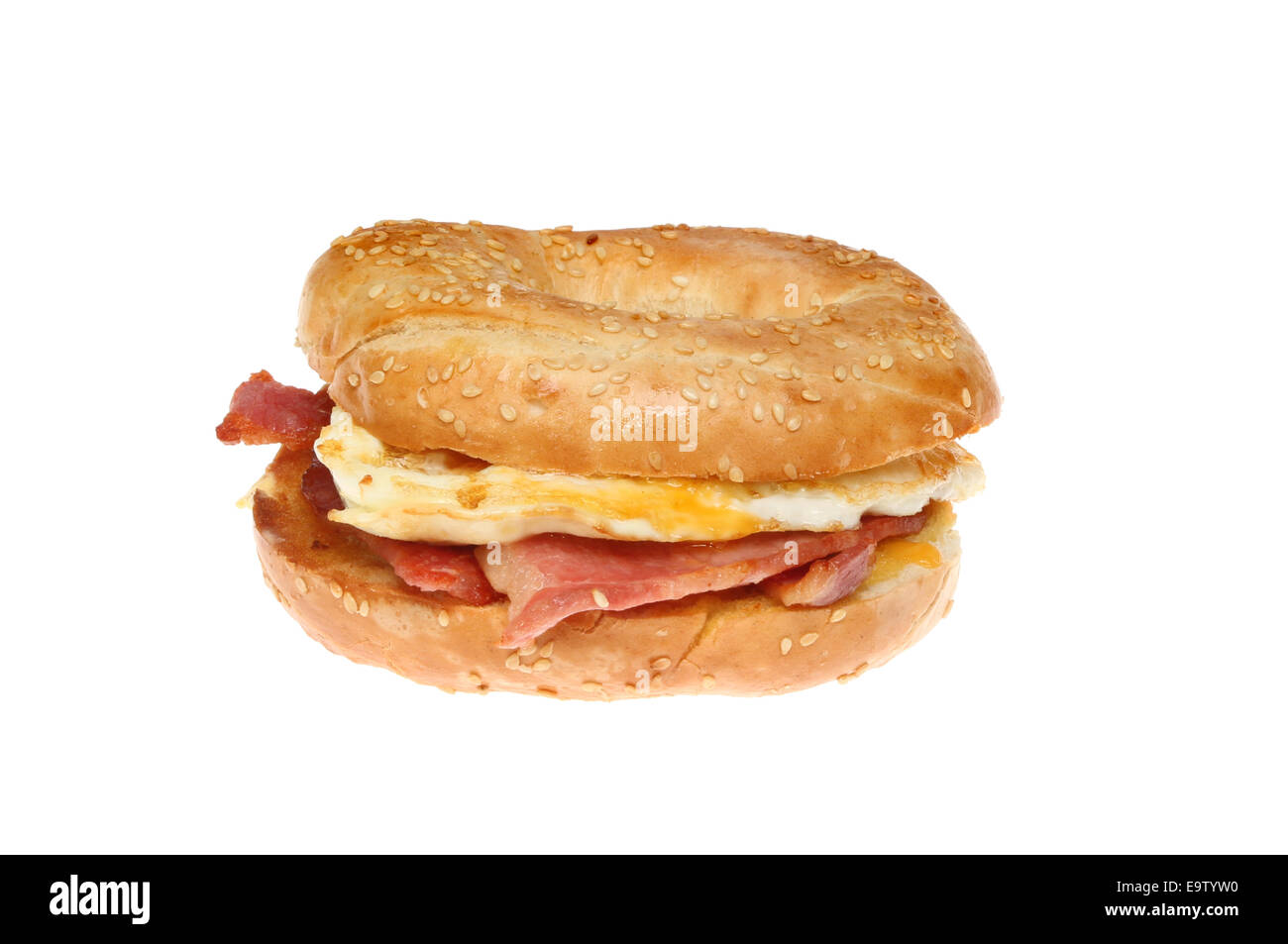 Fried egg and bacon bagel isolated against white Stock Photo