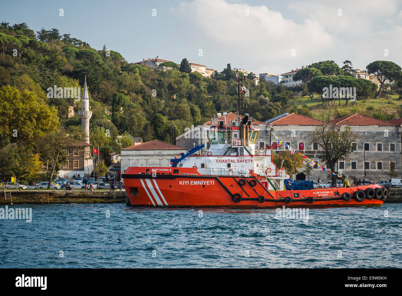 A coast guard vessel docked near a mosque in the Bosphorus near ...