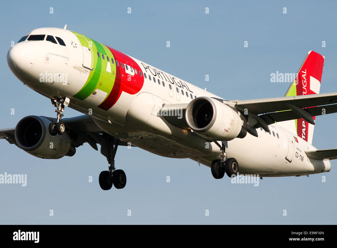 TAP Portugal Airbus A320 approaches runway 27L at London Heathrow Airport. Stock Photo