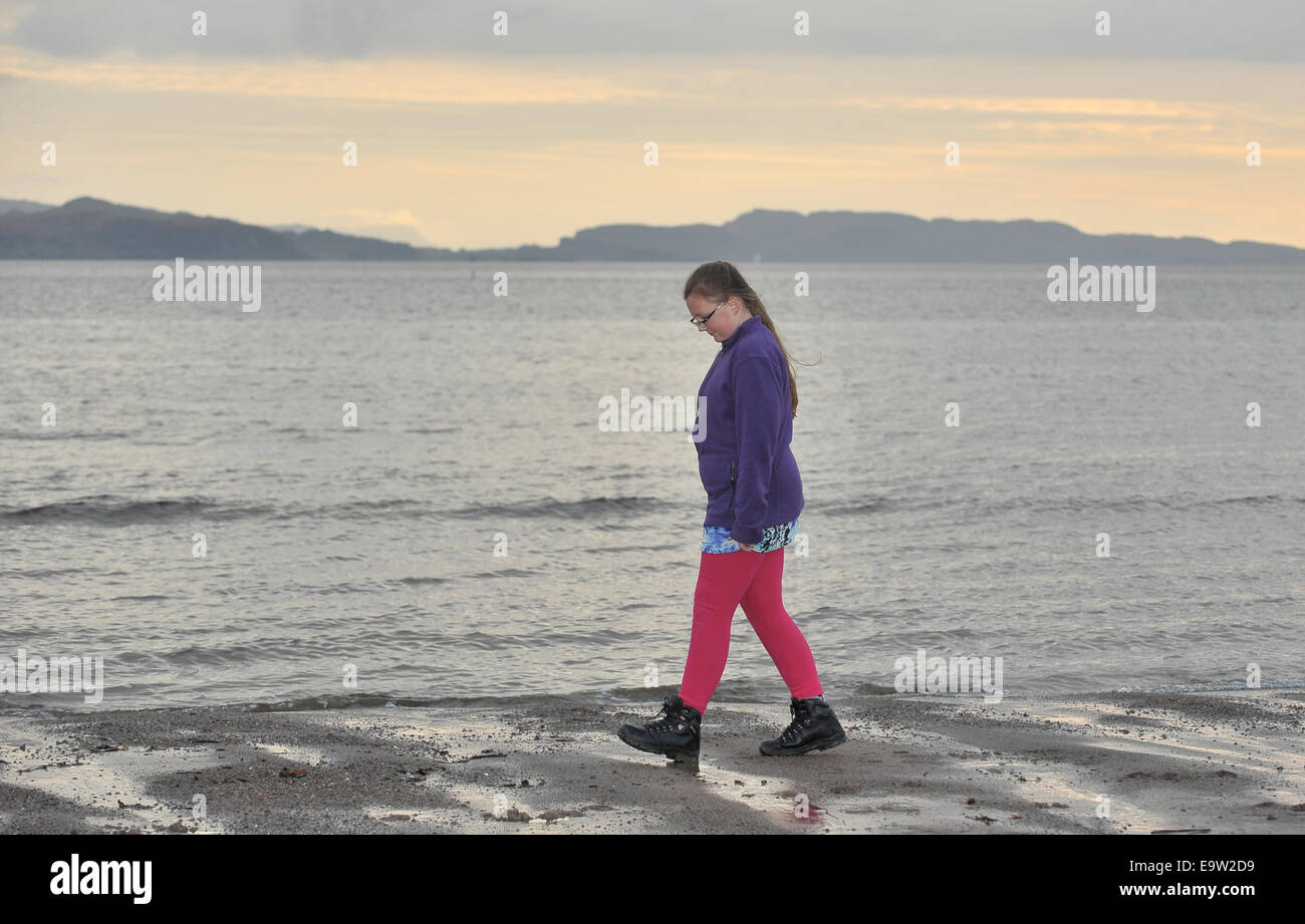 Girl on beach at Ardmucknish Bay, Benderloch, Scotland  2014.. UK. 29/10/2014. Stock Photo