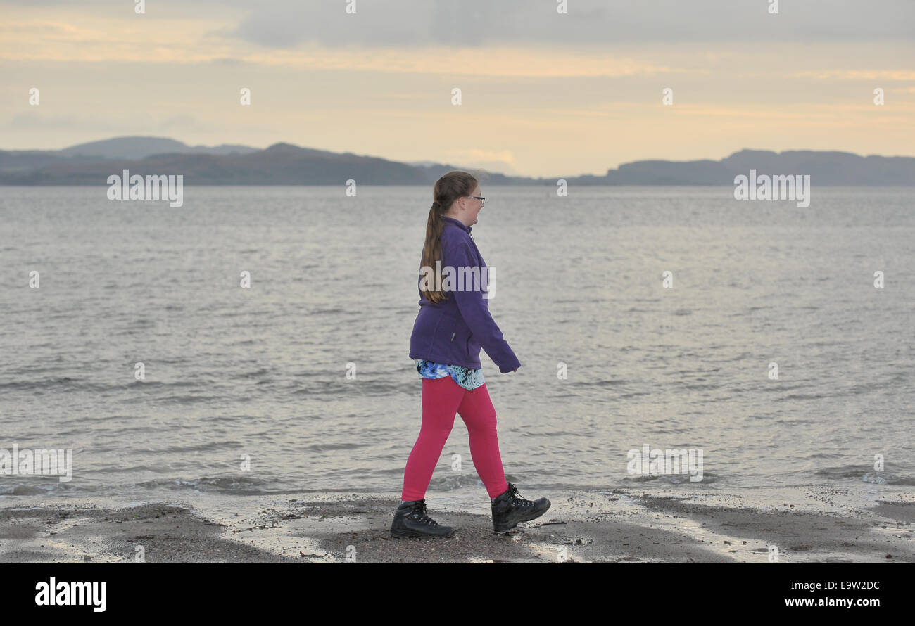 Girl on beach at Ardmucknish Bay, Benderloch, Scotland  2014.. UK. 29/10/2014. Stock Photo
