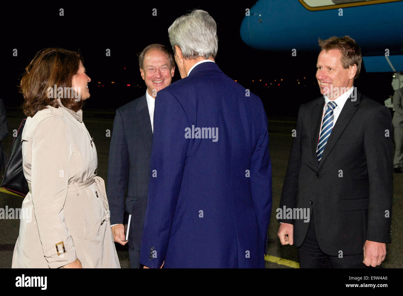 U.S. Secretary of State John Kerry chats with Deputy Assistant Secretary for European and Eurasian Affairs Julieta Vall Noyes, U.S. Ambassador to Germany John Emerson, and Peter Sauer, head of the German Foreign Office Protocol Office, after arriving in B Stock Photo