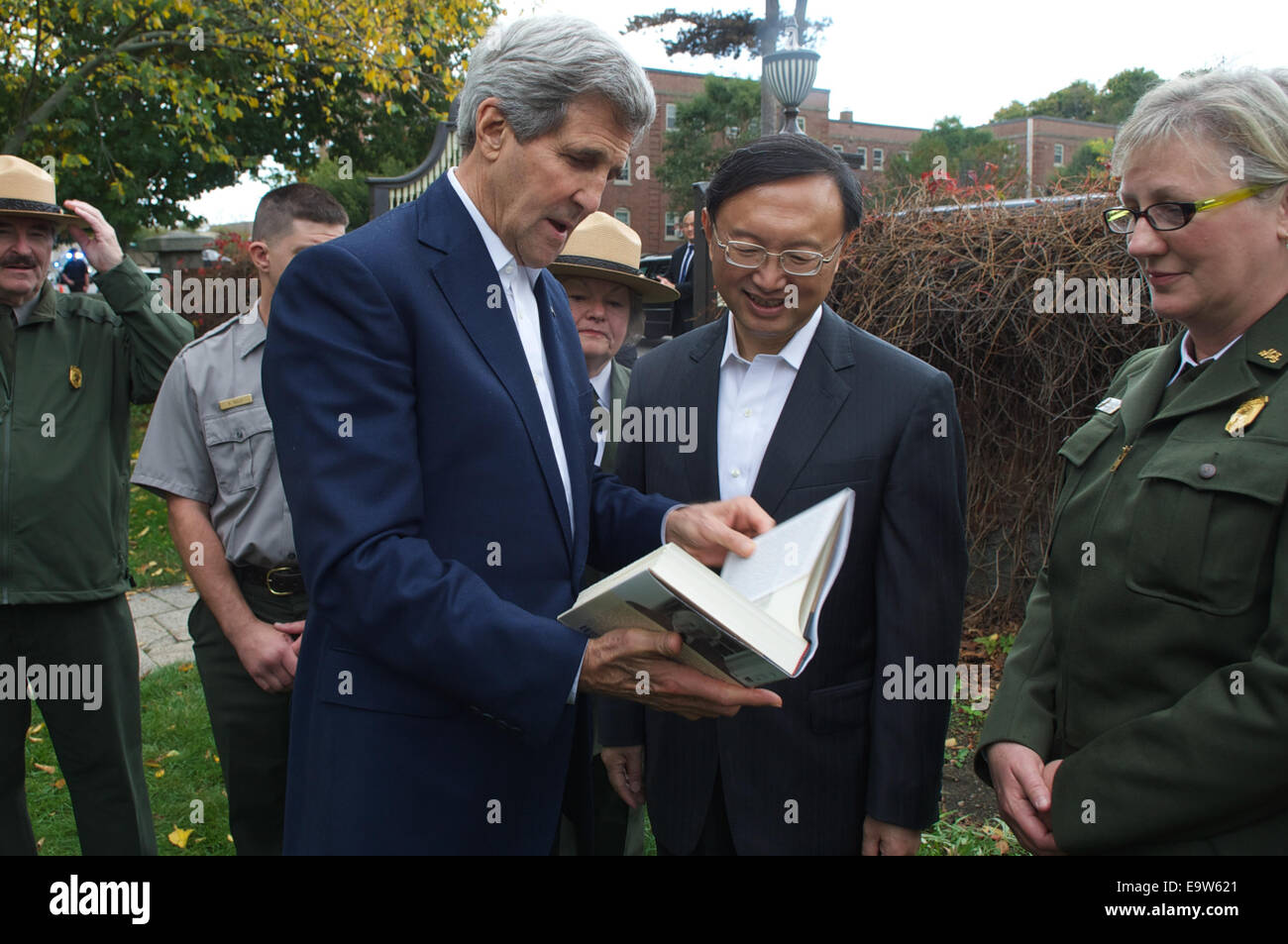 U.S. Secretary of State John Kerry presents Chinese State Councilor Yang Jiechi with an autographed copy of the John Adams biography by historian David McCullough after a tour of the Adams National Historical Site in Quincy, Massachusetts, following a ser Stock Photo