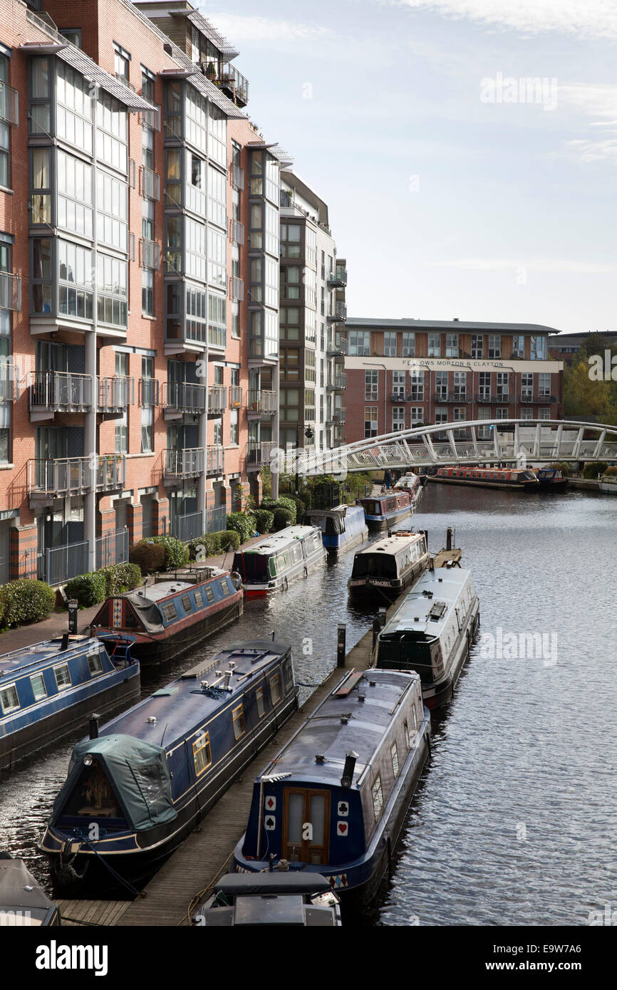 Modern apartments either side of the Old Birmingham canal in Brindleyplace, Birmingham City Centre Stock Photo