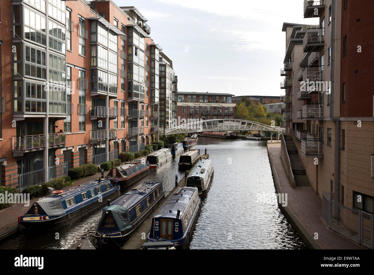 Modern apartments either side of the Old Birmingham canal in Brindleyplace, Birmingham City Centre Stock Photo