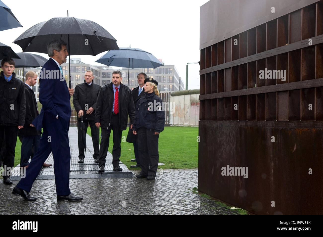 U.S. Secretary of State John Kerry approaches a memorial dedicated to those killed fleeing East Germany as he toured the remnants of the Berlin Wall to mark the 25th anniversary of its fall, and before the Secretary held a bilateral meeting with German Ch Stock Photo