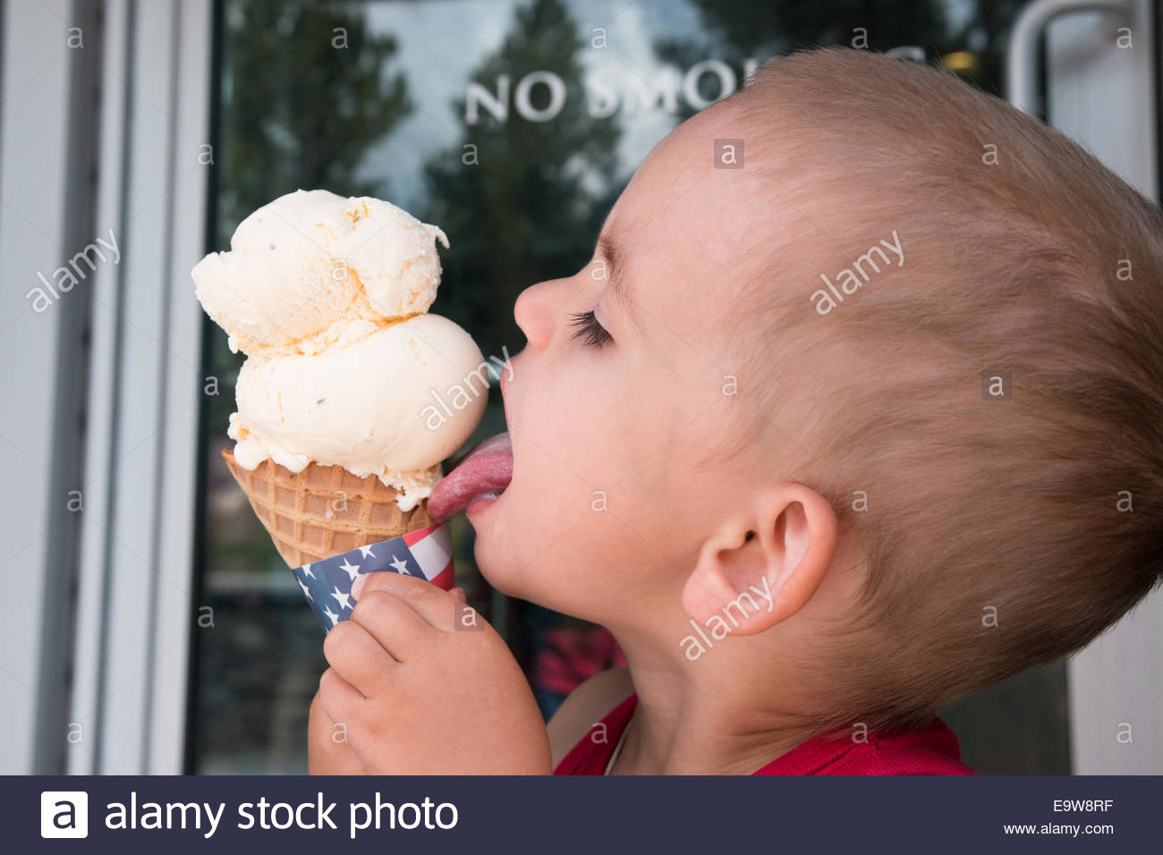 Boy Licking Ice Cream Cone Stock Photos & Boy Licking Ice Cream Cone