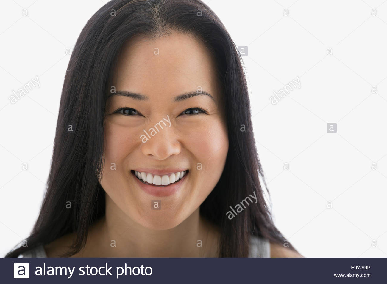 Portrait of smiling woman with black hair Stock Photo