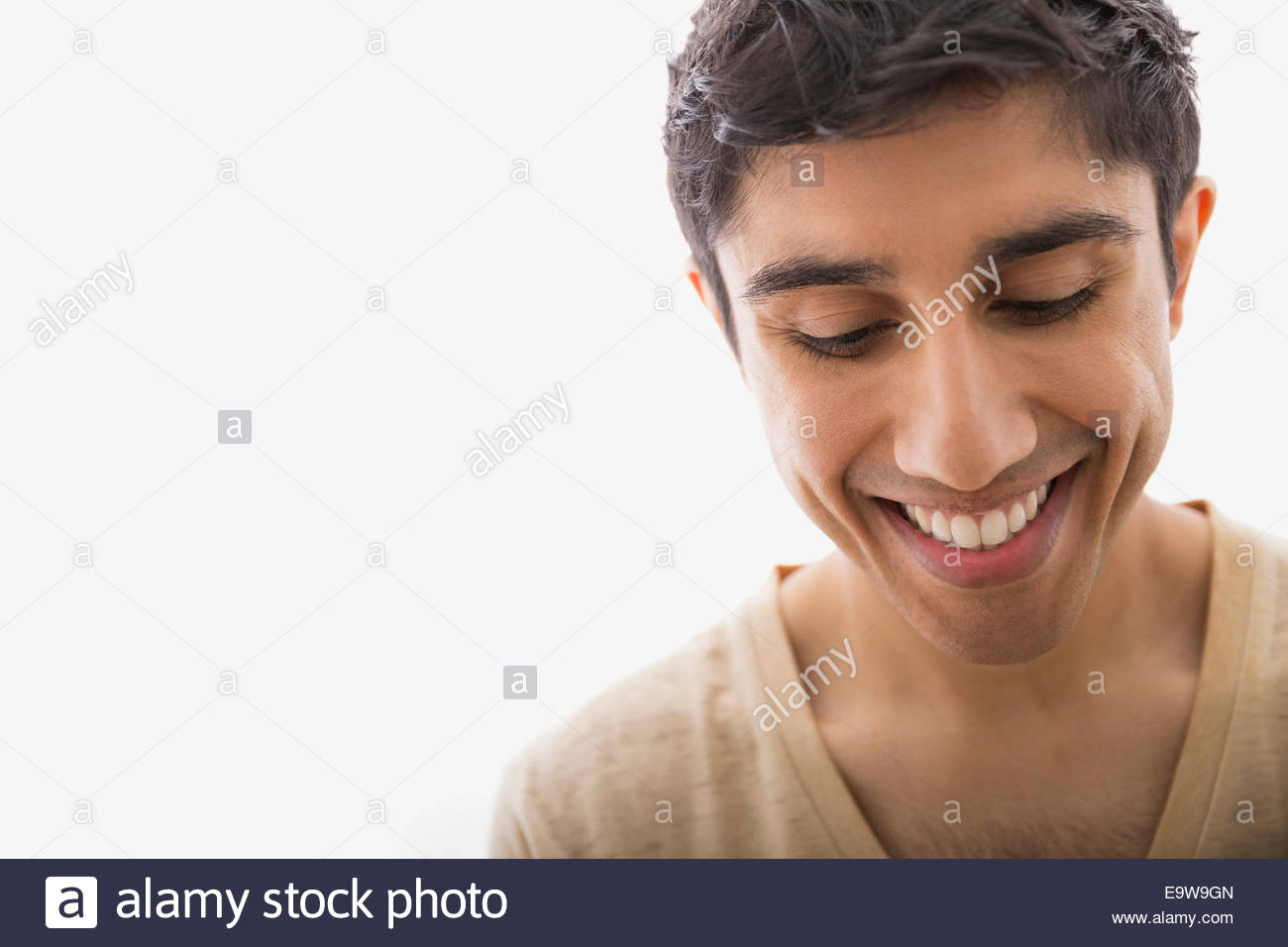 Close up portrait of smiling man looking down Stock Photo