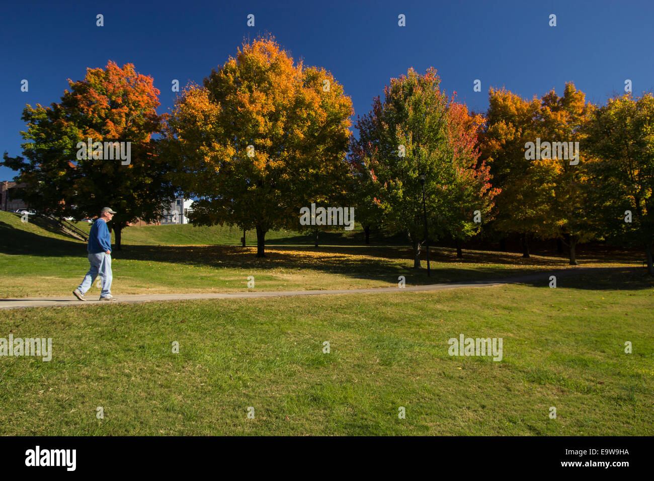 Older man walking outside hi-res stock photography and images - Alamy