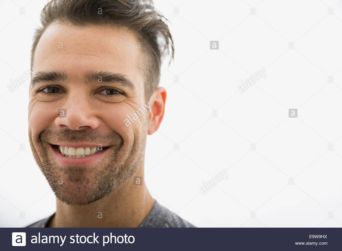 Close up portrait of smiling brunette man Stock Photo