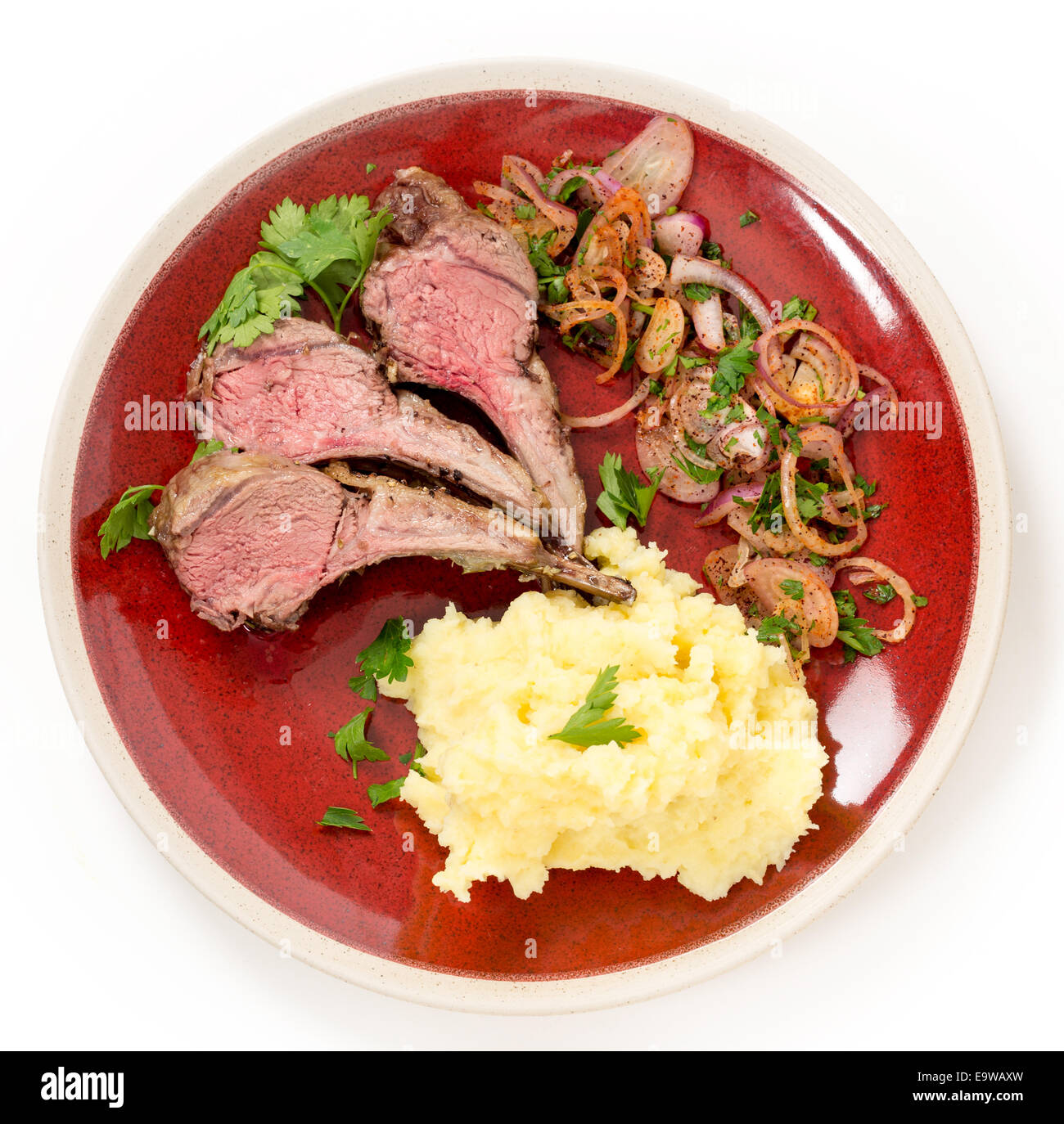 Lamb chops cut from a roast lamb rack and served with creamed garlic