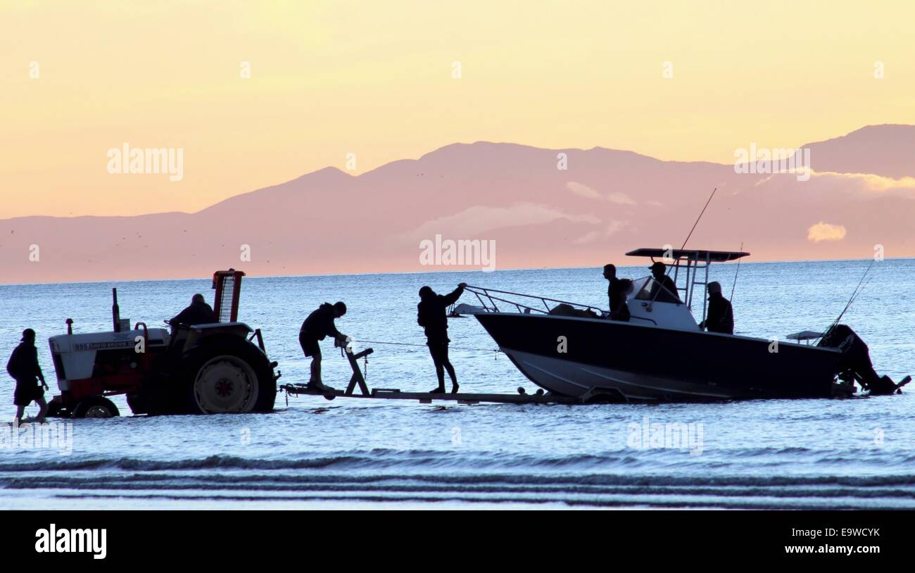 Fisherman at sunset silhouette Stock Photo - Alamy