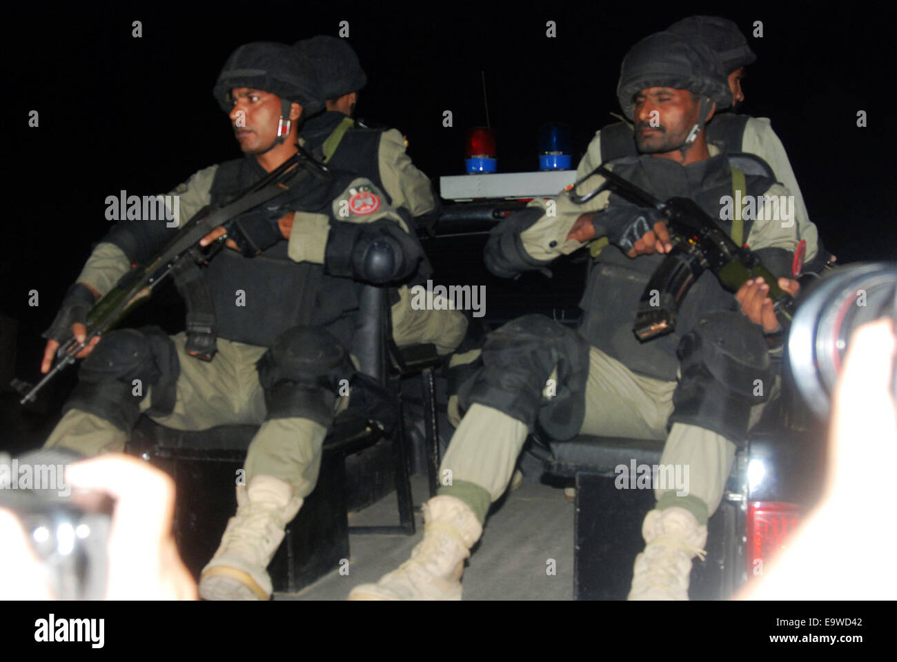 Lahore. 2nd Nov, 2014. Pakistani paramilitary troops patrol near the site of a suicide bomb attack at Wagah border in eastern Pakistan's Lahore, Nov. 2, 2014. At least 55 people were killed and 118 others injured in a suicide blast that took place near Wagah crossing point at Pak-India border in Pakistan's eastern city of Lahore on Sunday evening, police officials said. © Sajjad/Xinhua/Alamy Live News Stock Photo