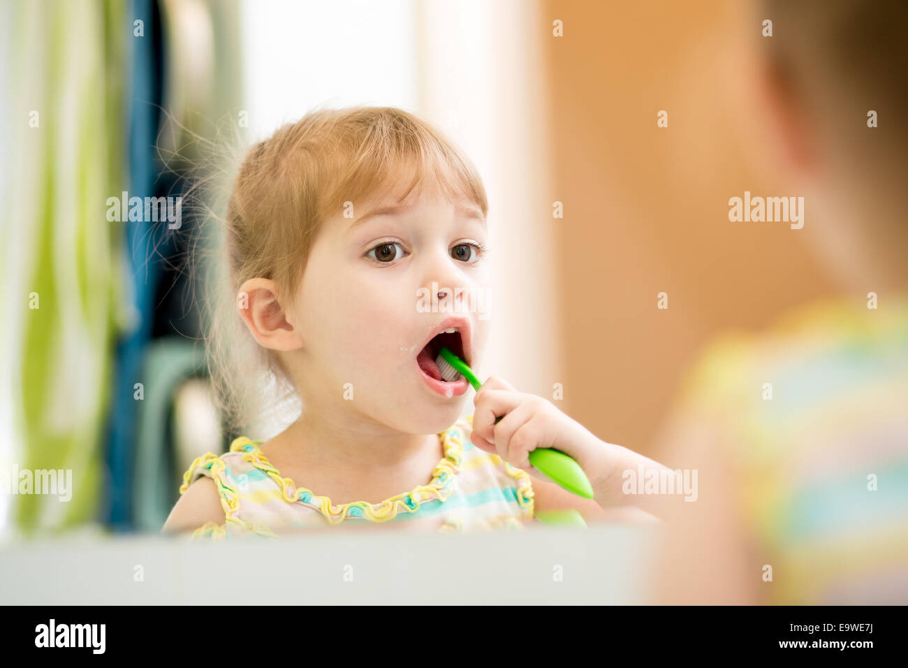child girl brushing teeth Stock Photo
