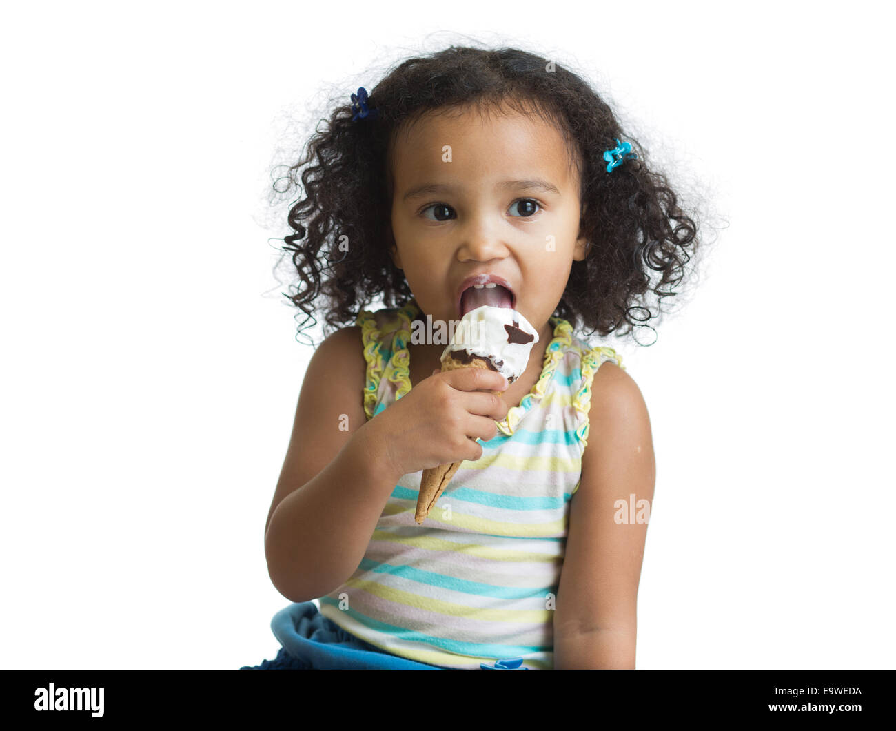 mulatto kid eating ice cream isolated Stock Photo