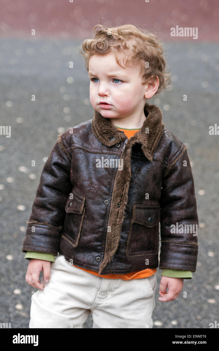 A two year old boy wears a leather jacket in Central Park in New York City Stock Photo Alamy