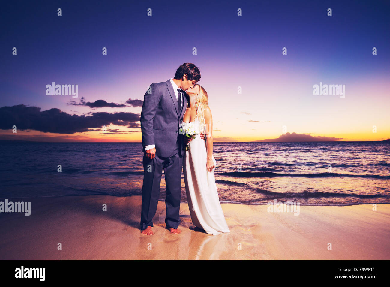Beautiful Wedding Couple, Bride and Groom Kissing on the Beach at ...