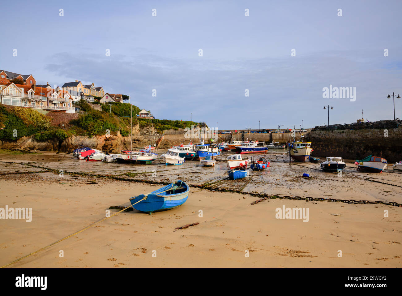Newquay harbour North Cornwall England UK with boats and sandy beach Stock Photo