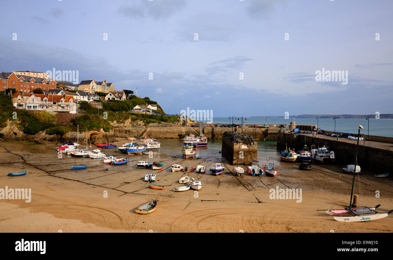 Newquay harbour low tide North Cornwall England UK with boats and sandy beach Stock Photo