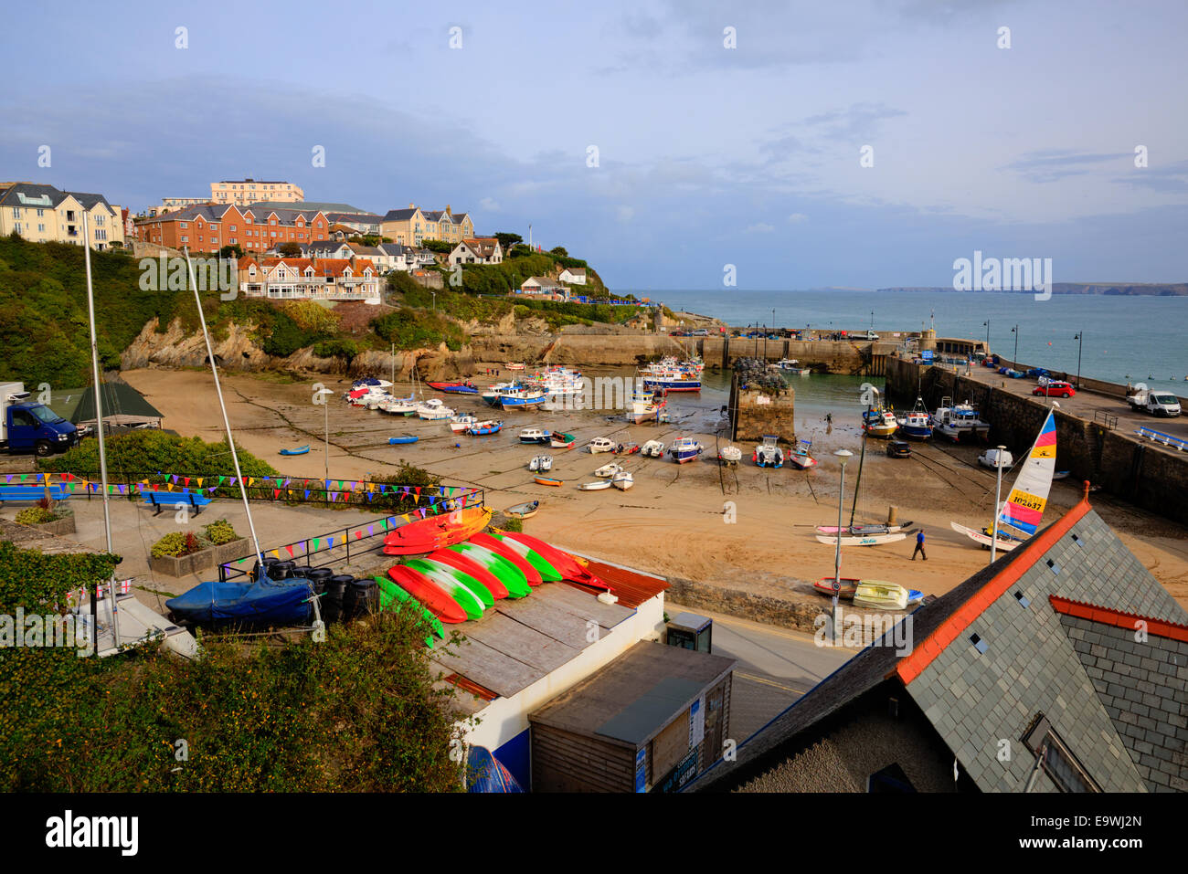 Newquay harbour colourful boats North Cornwall England UK sandy beach Stock Photo
