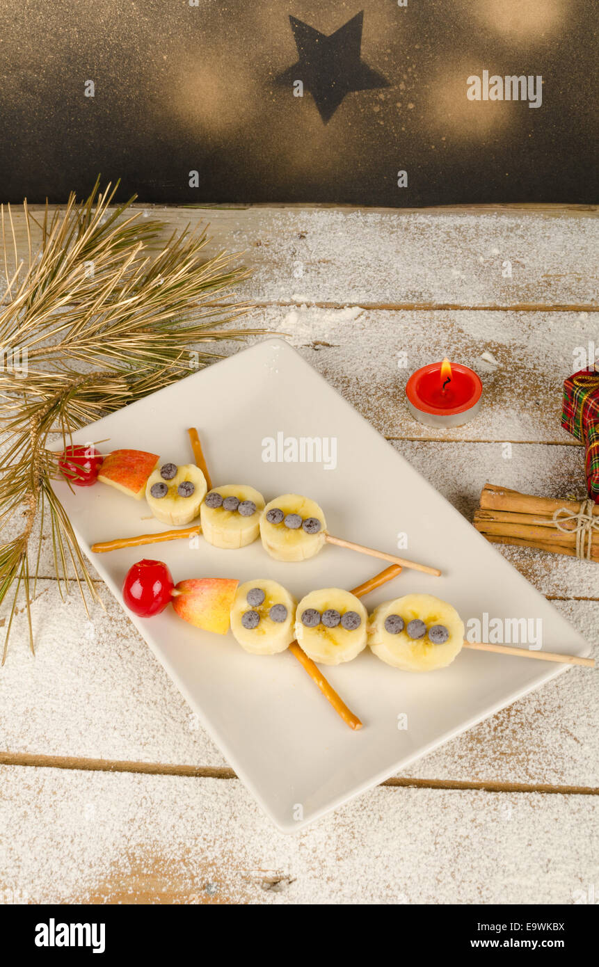 Fruity Christmas dessert set up and decorated as a kid meal Stock Photo