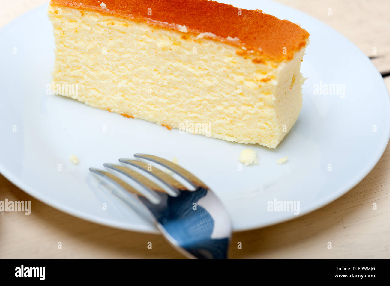 fresh made cheese cake over white wood table Stock Photo