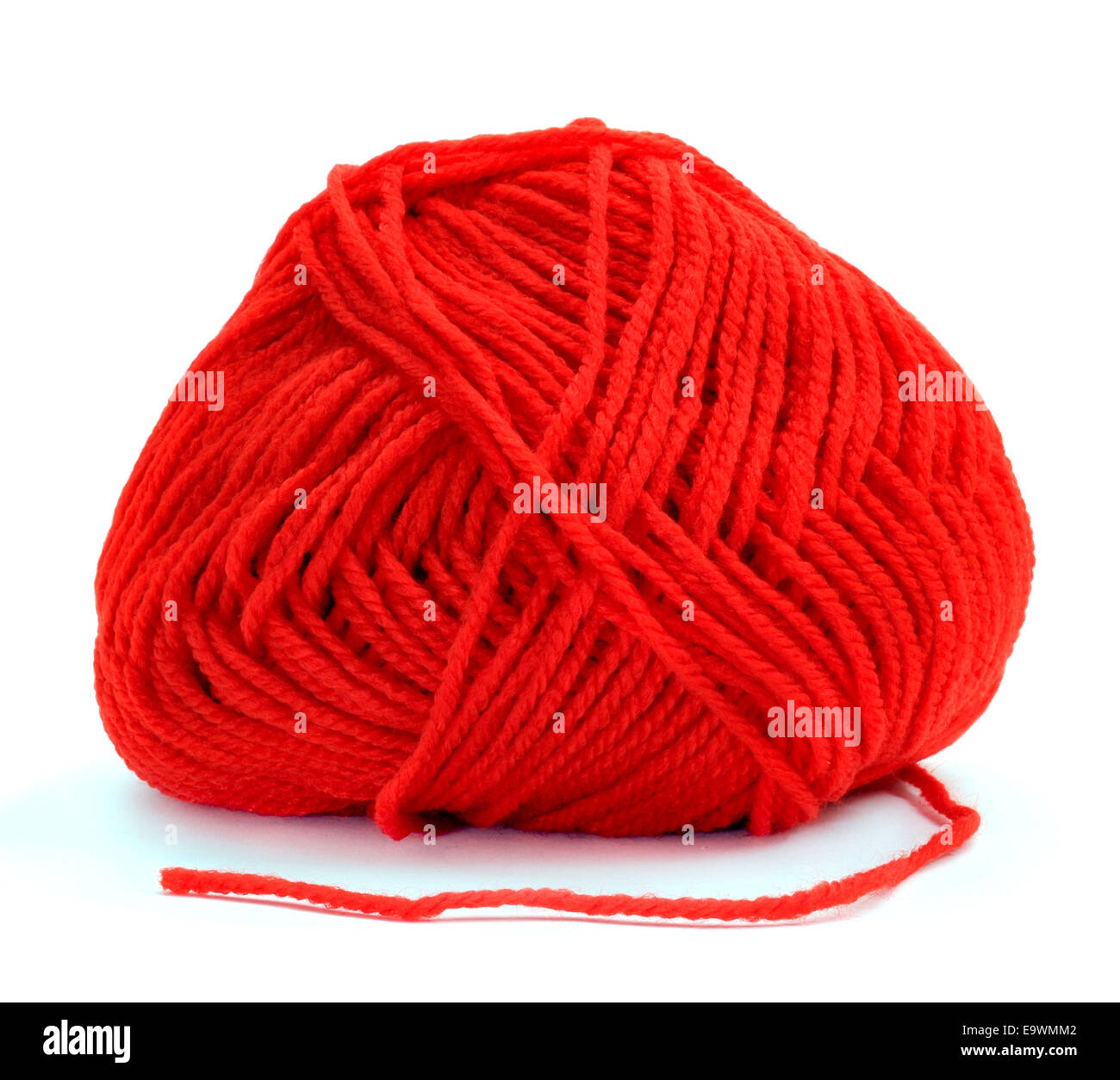 a ball of red yarn for knitting on a white background Stock Photo