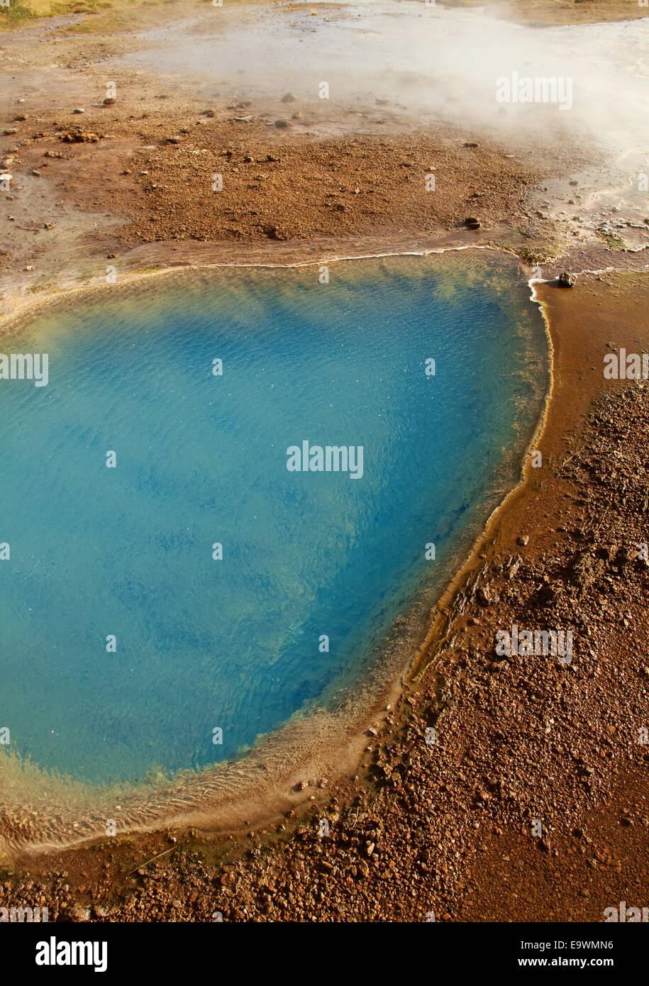 Hot lake next to geyser in Iceland Stock Photo