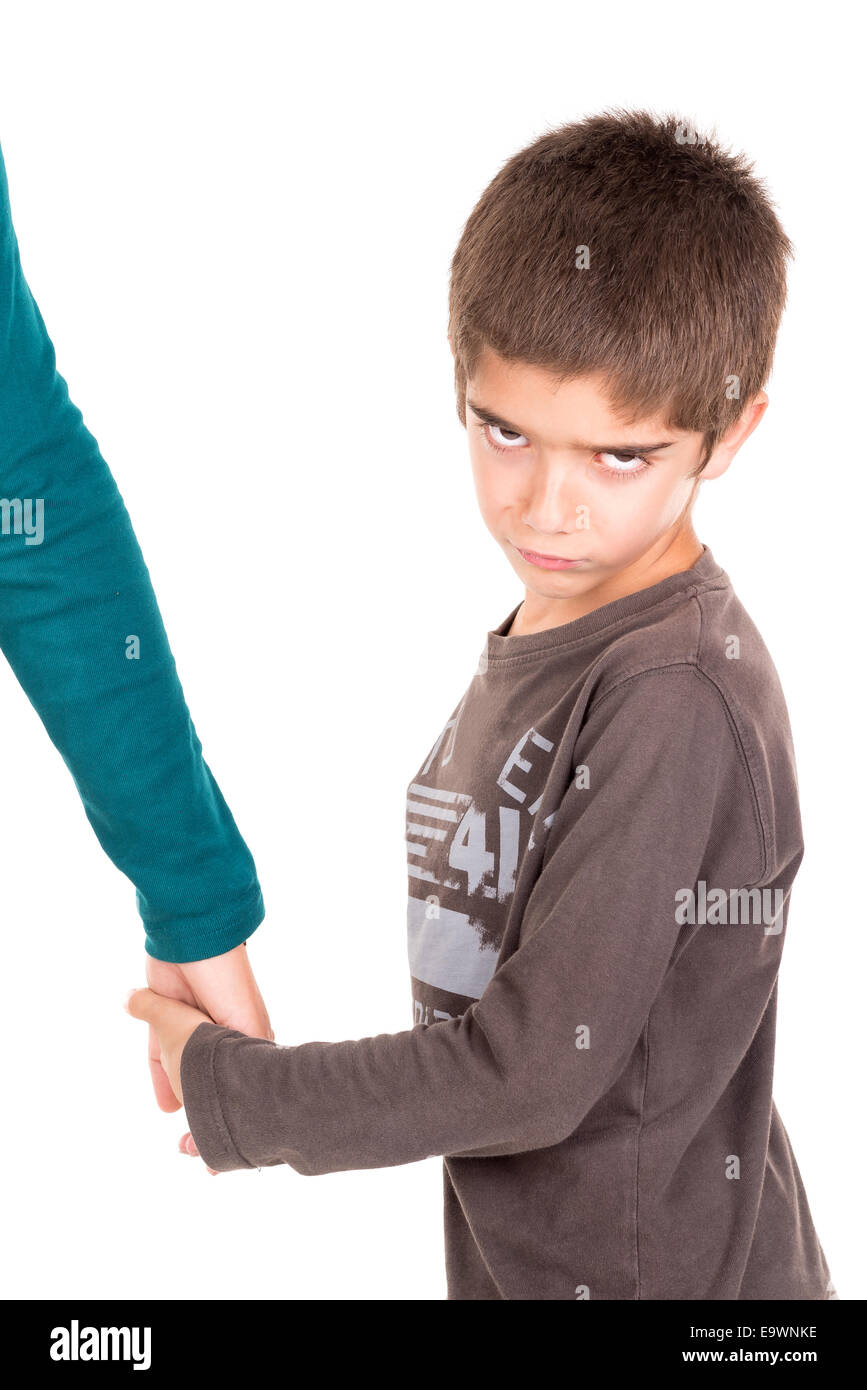 Young boy making faces and holding his mother's hand Stock Photo