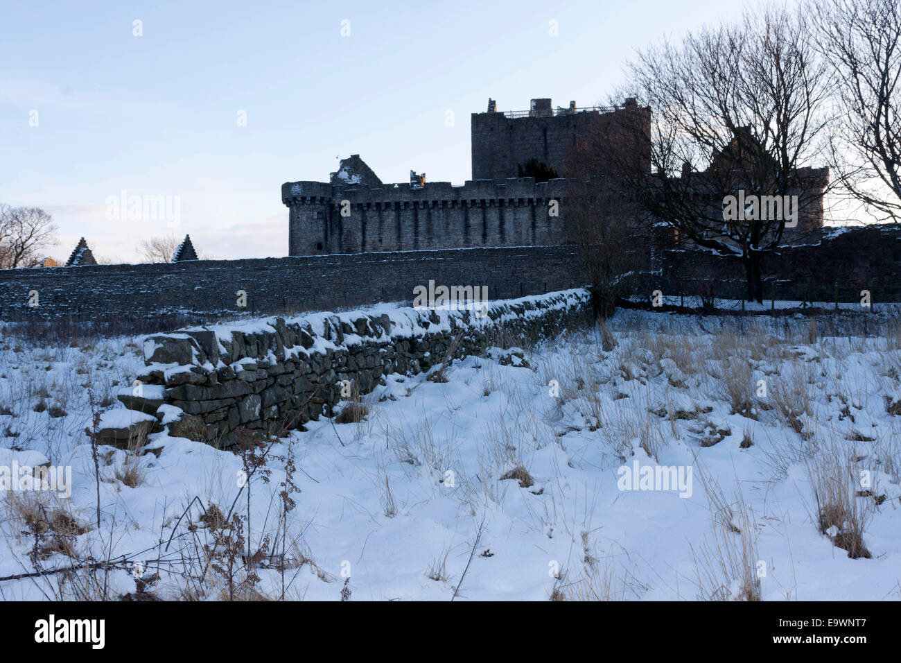 A view of Craigmillar Castle snowed during the afternoon evening sunset. Stock Photo
