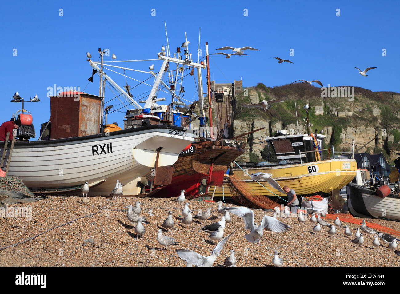 Seagulls and fishing boats on Hastings Old Town Stade beach. Hastings