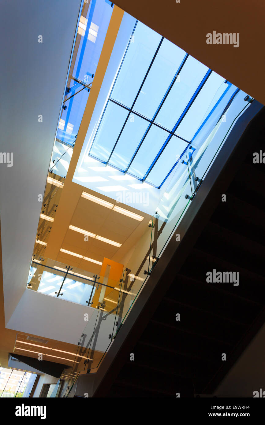Looking up into atrium in corridor of modern building Stock Photo