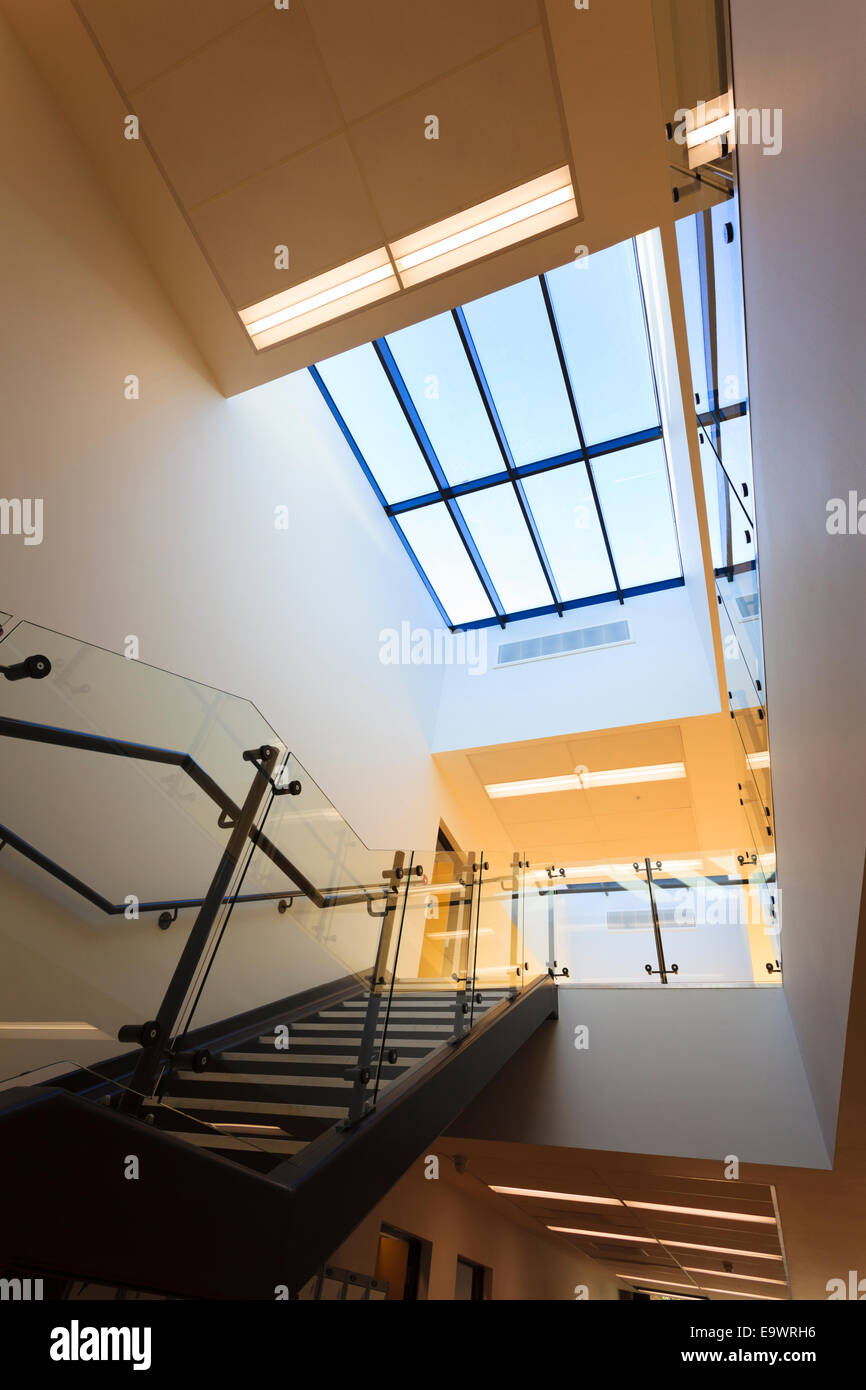 Looking up stairs into atrium of corridor of modern building Stock Photo