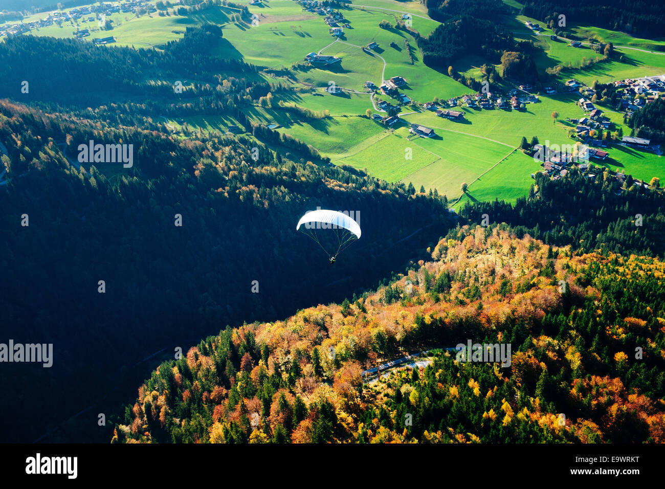 Paraglider flying over Unterberg in Kossen, Tirol, Austria Stock Photo