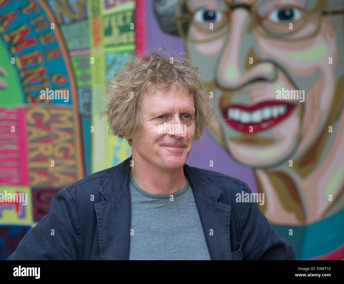 Grayson Perry with his work 'Comfort Blanket' 2014 at the National Portrait Galley part of the 'Who are you?' exhibition Stock Photo