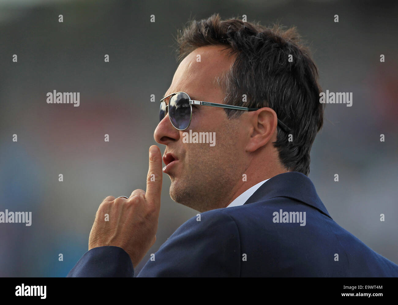 Cricket - Commentator and ex England captain Michael Vaughan raises his finger to his lips in a silencing gesture Stock Photo