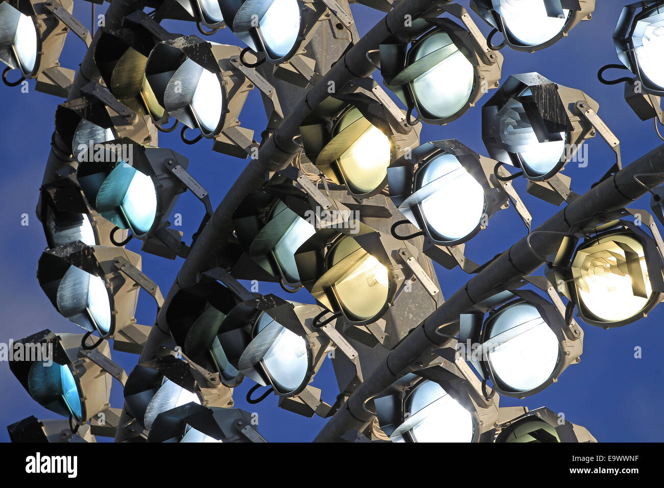 Section of a floodlight switching on against a blue sky Stock Photo